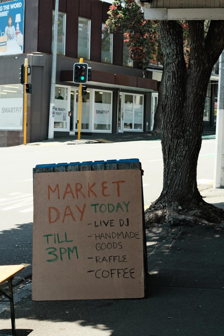 TBC Market Day signage on the sidewalk
