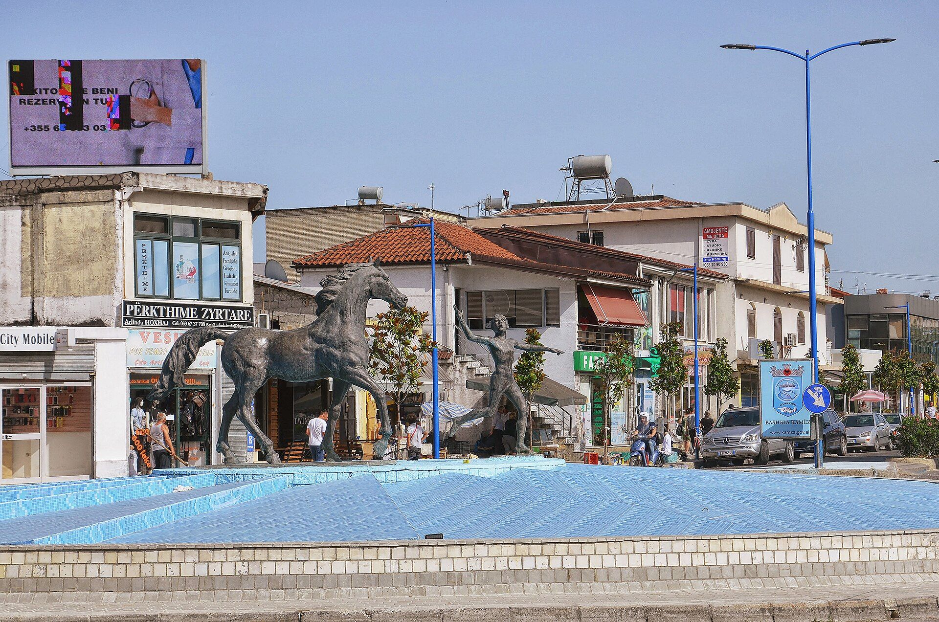 The fountain and horse statues in Kamëz town centre — Pasztilla aka Attila Terbócs
