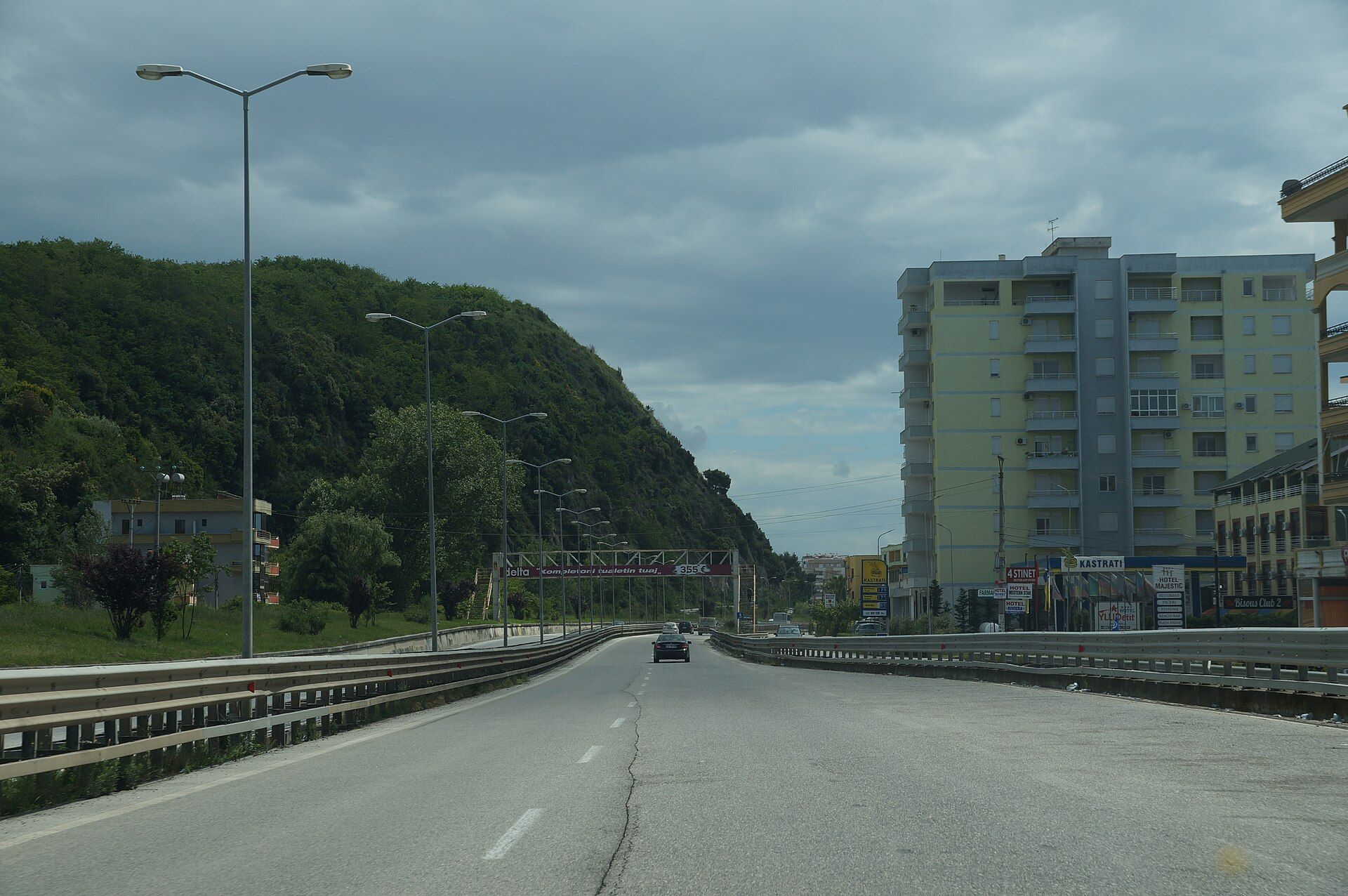 The coastal highway passing the rock at Shkëmbi i Kavajës