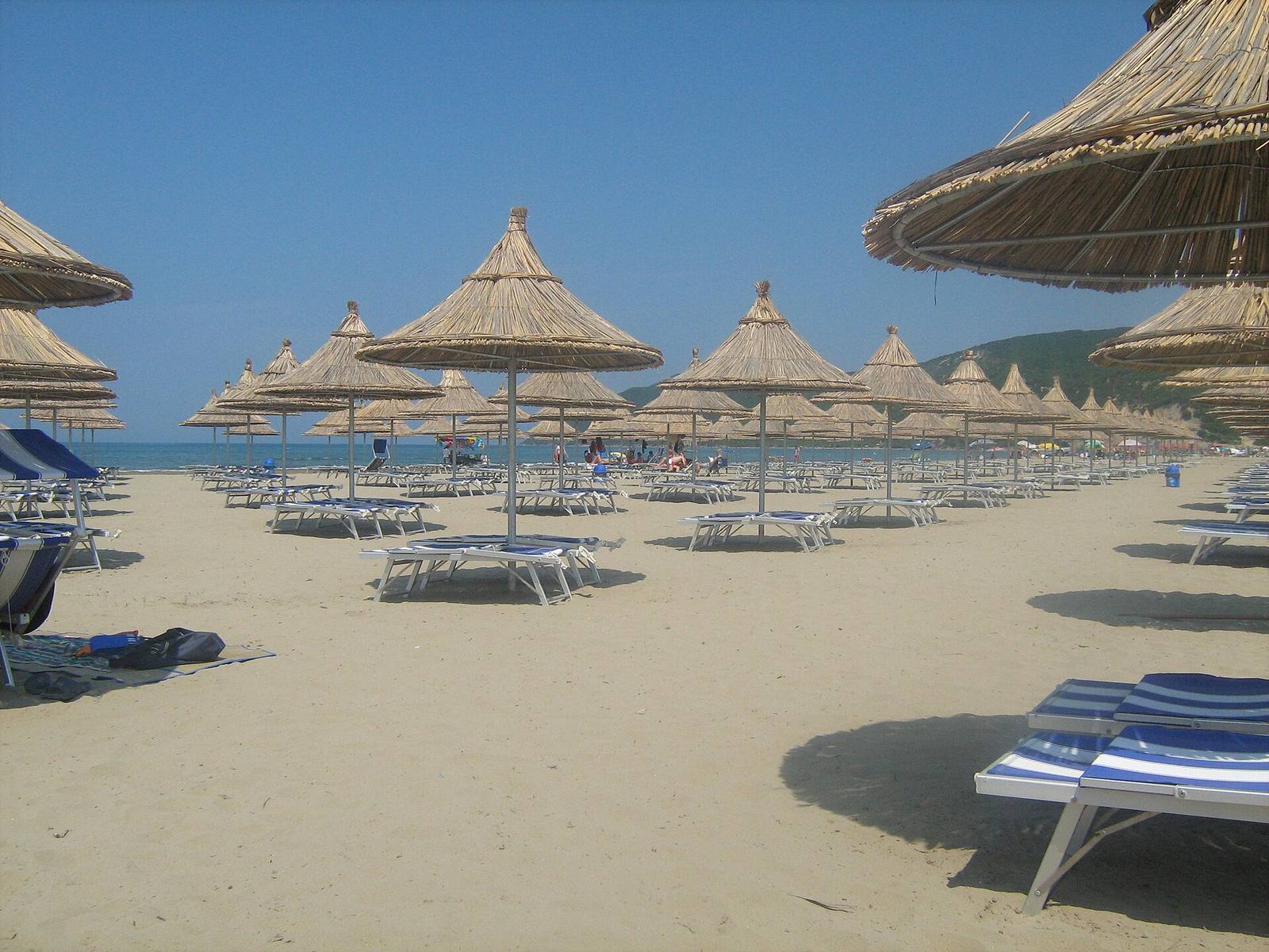 Straw umbrellas on the beach of Lalzi Bay (Gjiri i Lalzit), Durrës, Albania