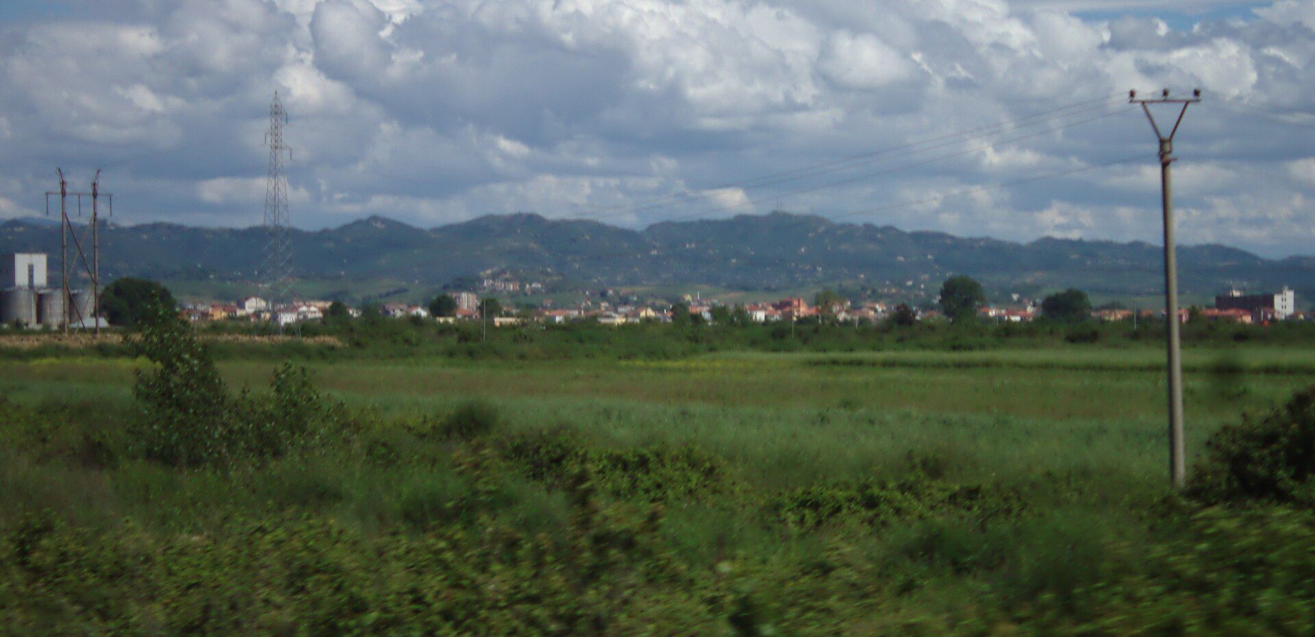 Fields beside the Durrës–Tirana motorway near Xhafzotaj, Albania — Aktron (Wikimedia Commons)
