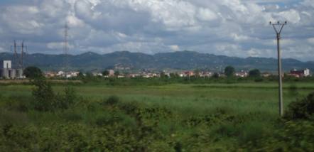 Fields beside the Durrës–Tirana motorway near Xhafzotaj, Albania — Aktron (Wikimedia Commons)