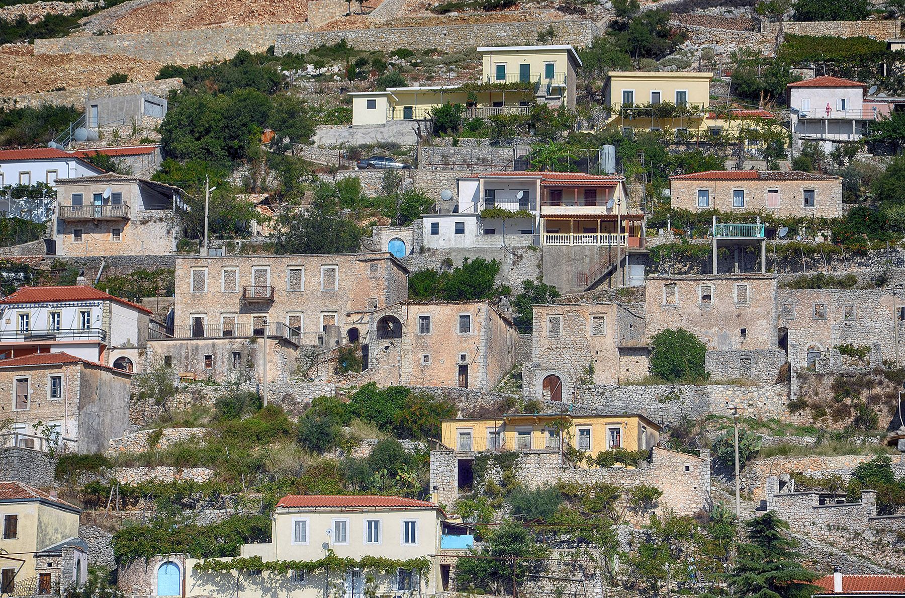 Stone houses on the terraced hillside of Vuno, Himarë, Albania — Pasztilla aka Attila Terbócs
