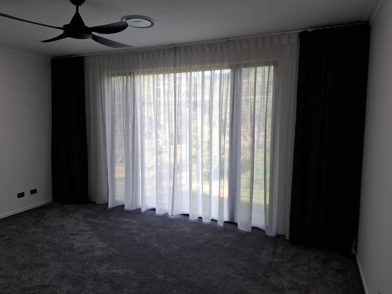 Close-up of curtain pleat detail showing fabric gathering