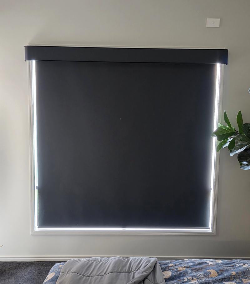 Motorised blind with remote control showing smart home integration
