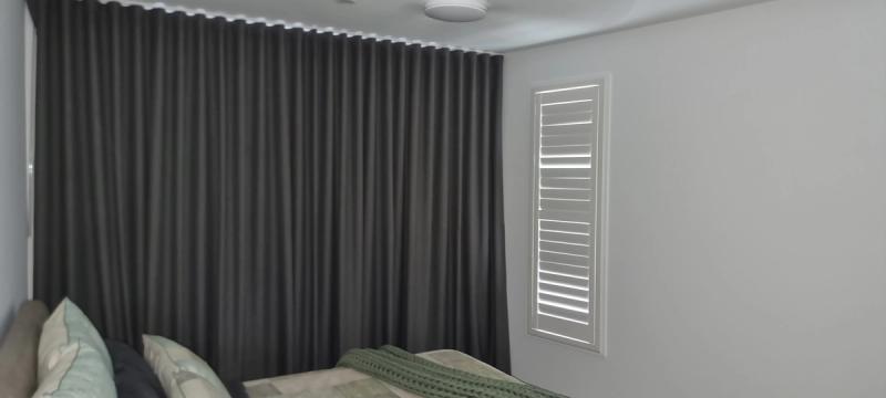 Motorised curtain track system close-up showing concealed motor