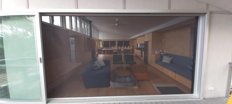 Retractable door screen installation Centor single direction retractable screen living area
