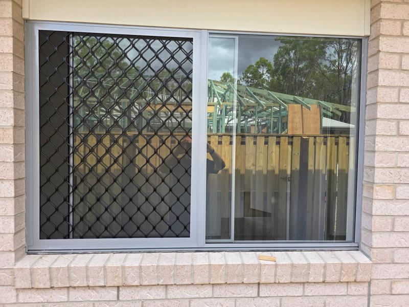 Barrier screen installation Fixed barrier screen on sliding window