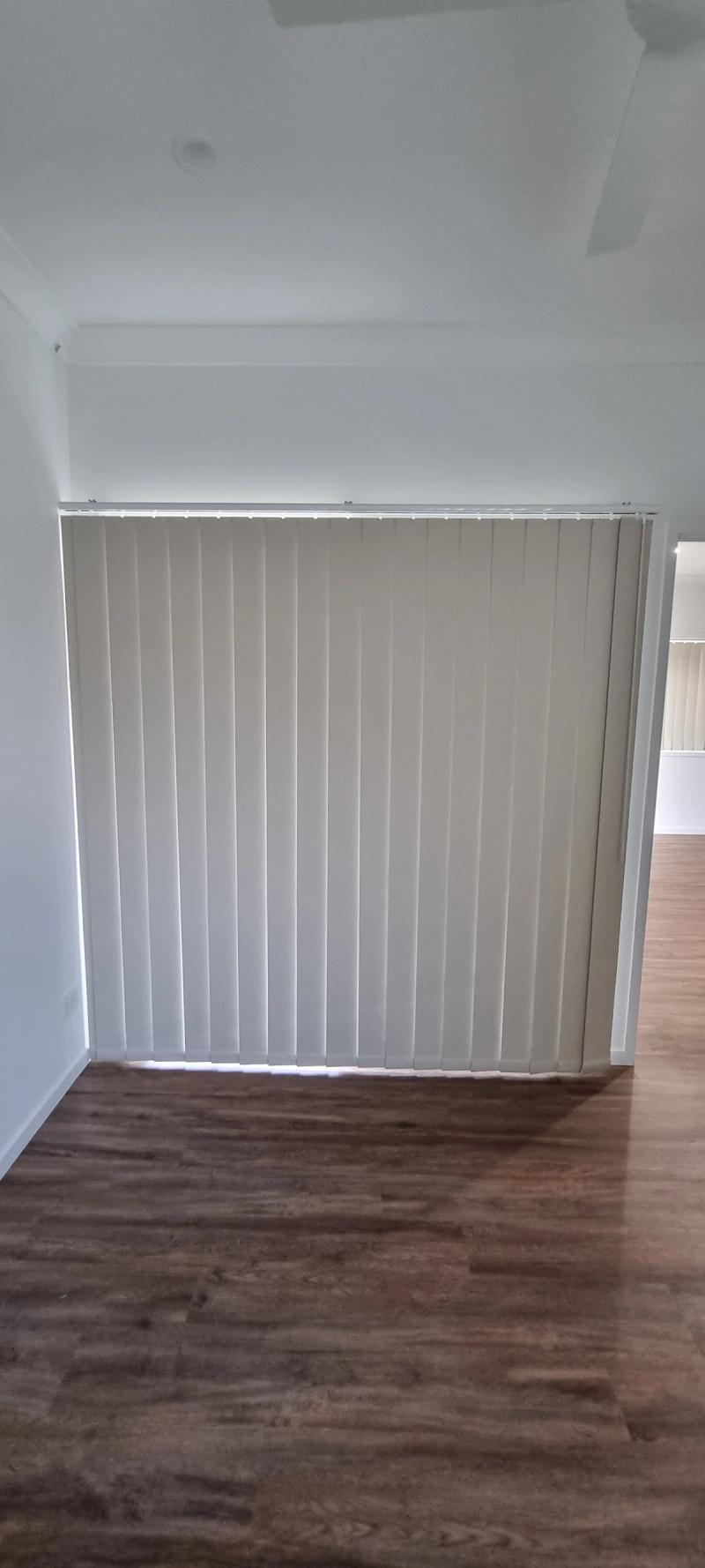 Vertical blind installation Vertical blinds in living area.jpg