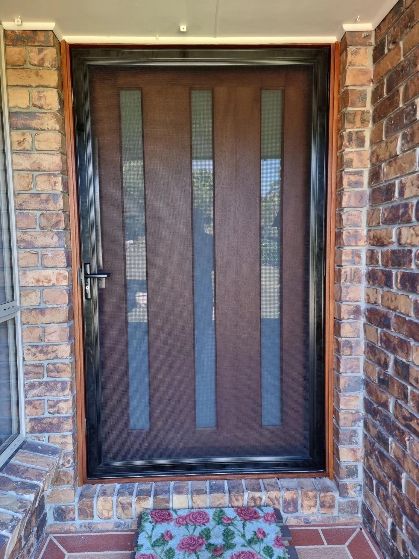 SecureView 316 stainless steel mesh hinged security door with a clear view through to the entry