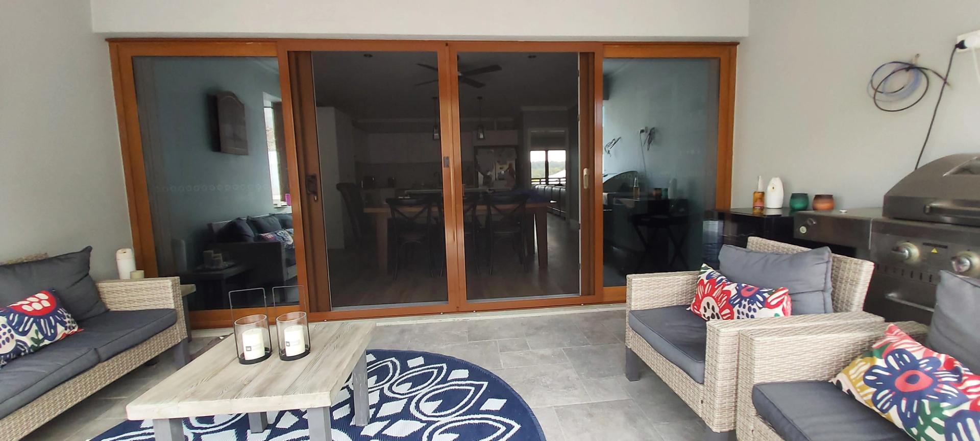 Insect door screen installation on Gold Coast home