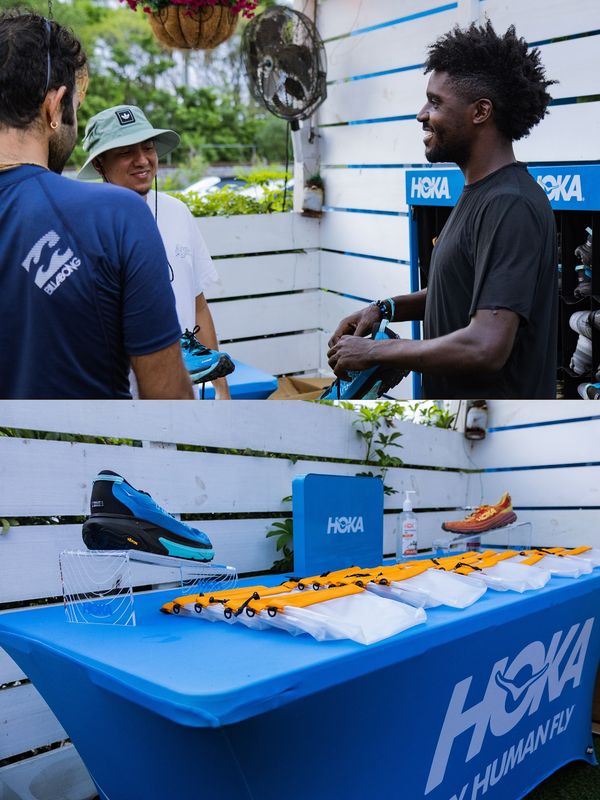 Participants visit the HOKA trail-shoe table at Roots Fly High.
