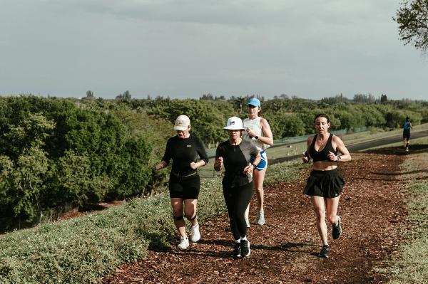 A group of runners climbs a hill at Vista View Park.