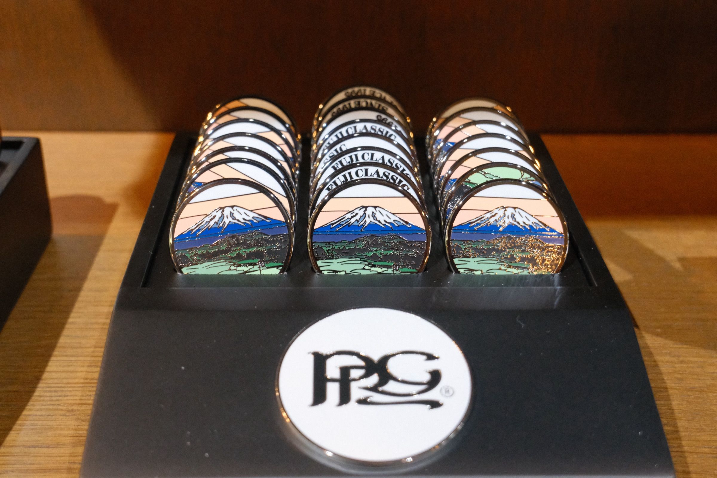 Trays of Fuji Classic ball markers in the pro shop