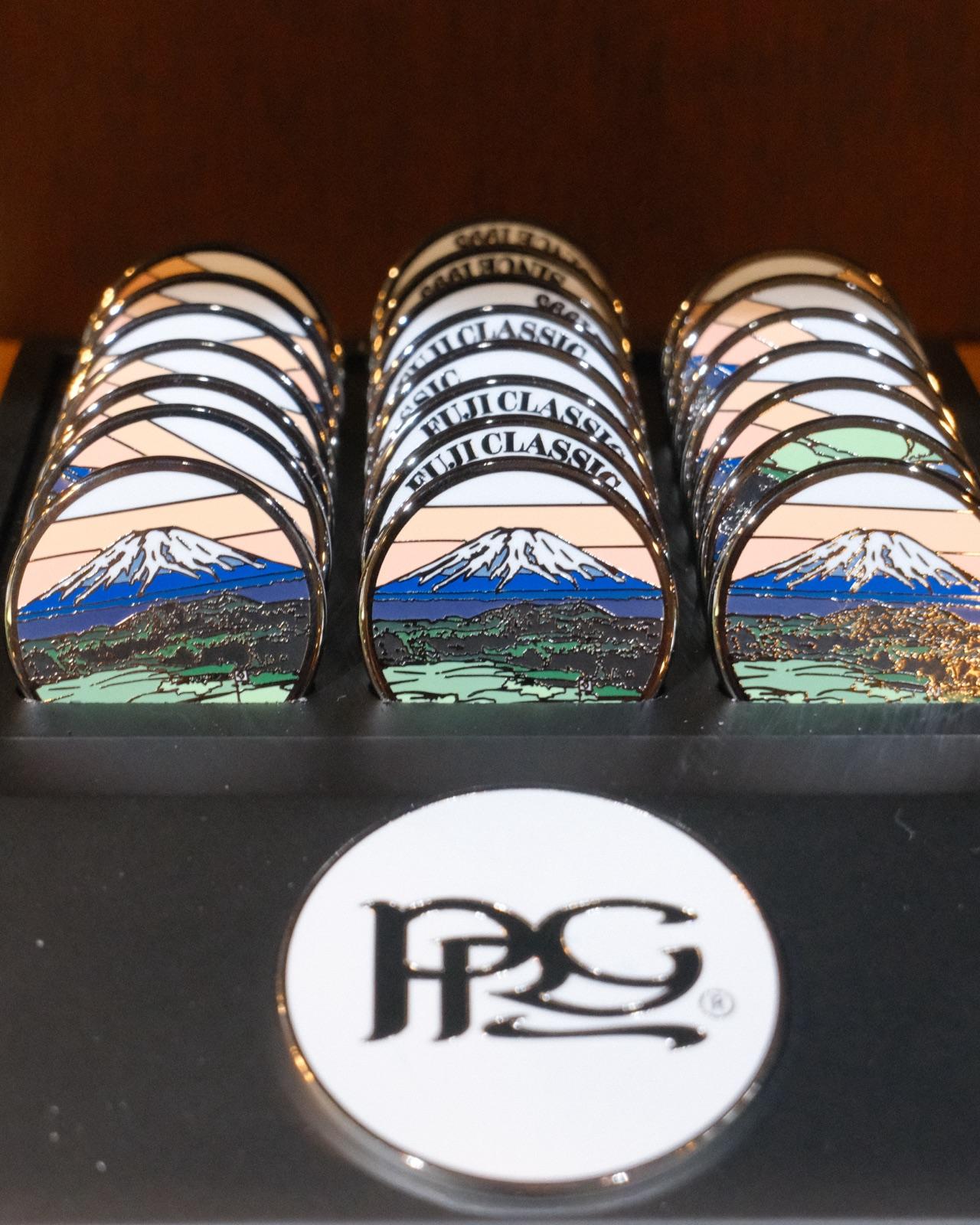 Trays of Fuji Classic ball markers in the pro shop