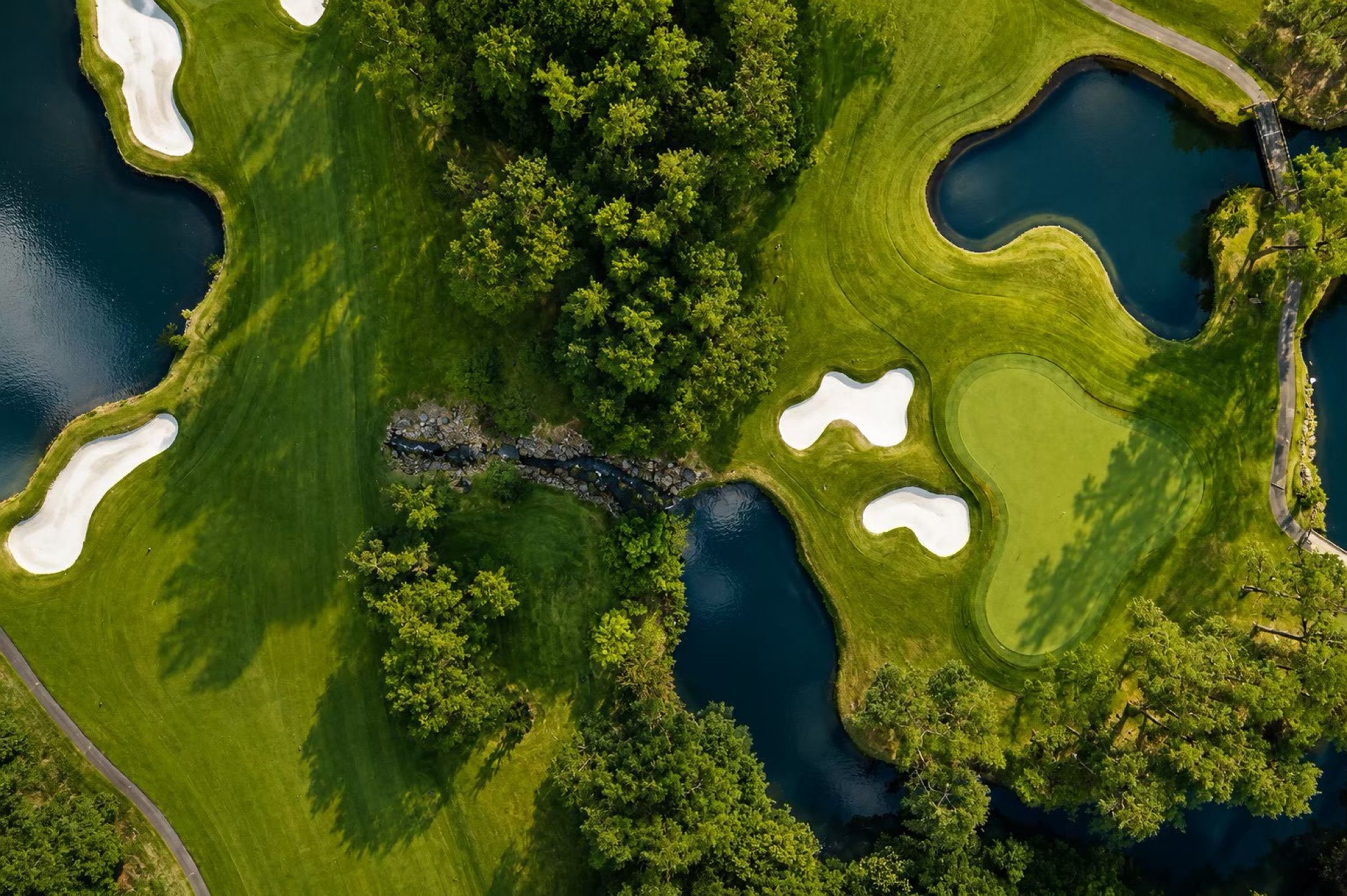 Overhead view of greens, bunkers and ponds