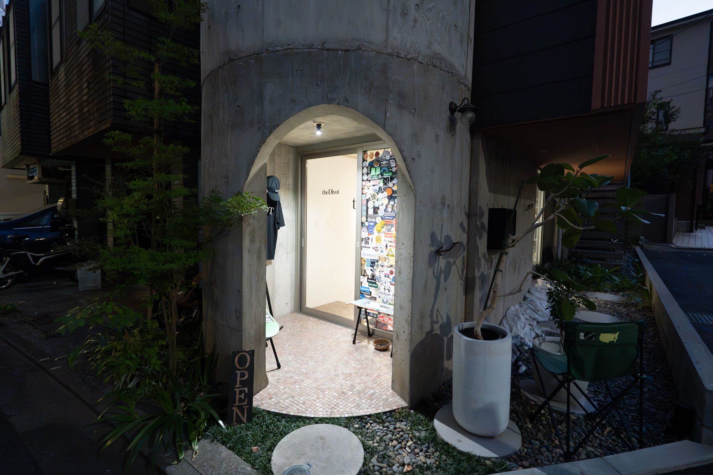 the Divot STORE exterior — the concrete arched entrance and OPEN flag in Sendagaya, Tokyo