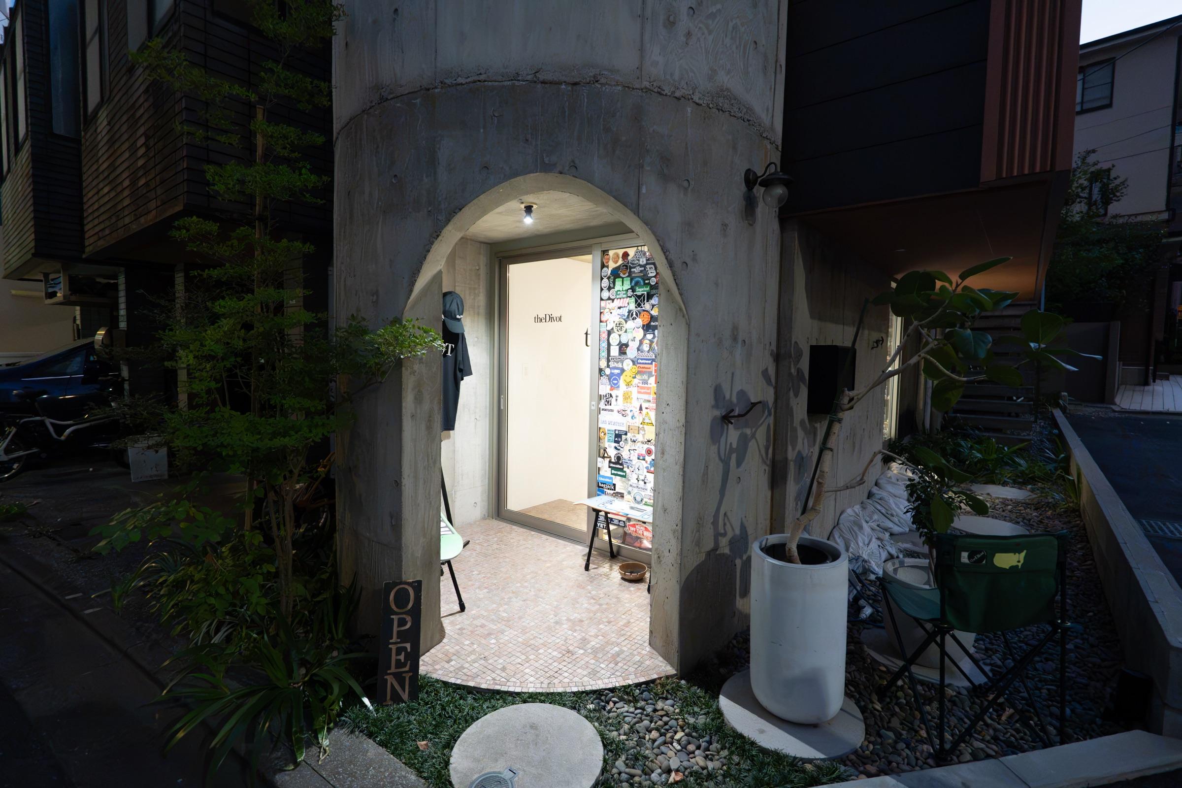 the Divot STORE exterior — the concrete arched entrance and OPEN flag in Sendagaya, Tokyo