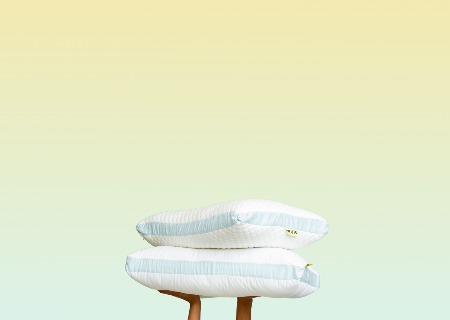 A custom Pluto pillow against a light blue background.