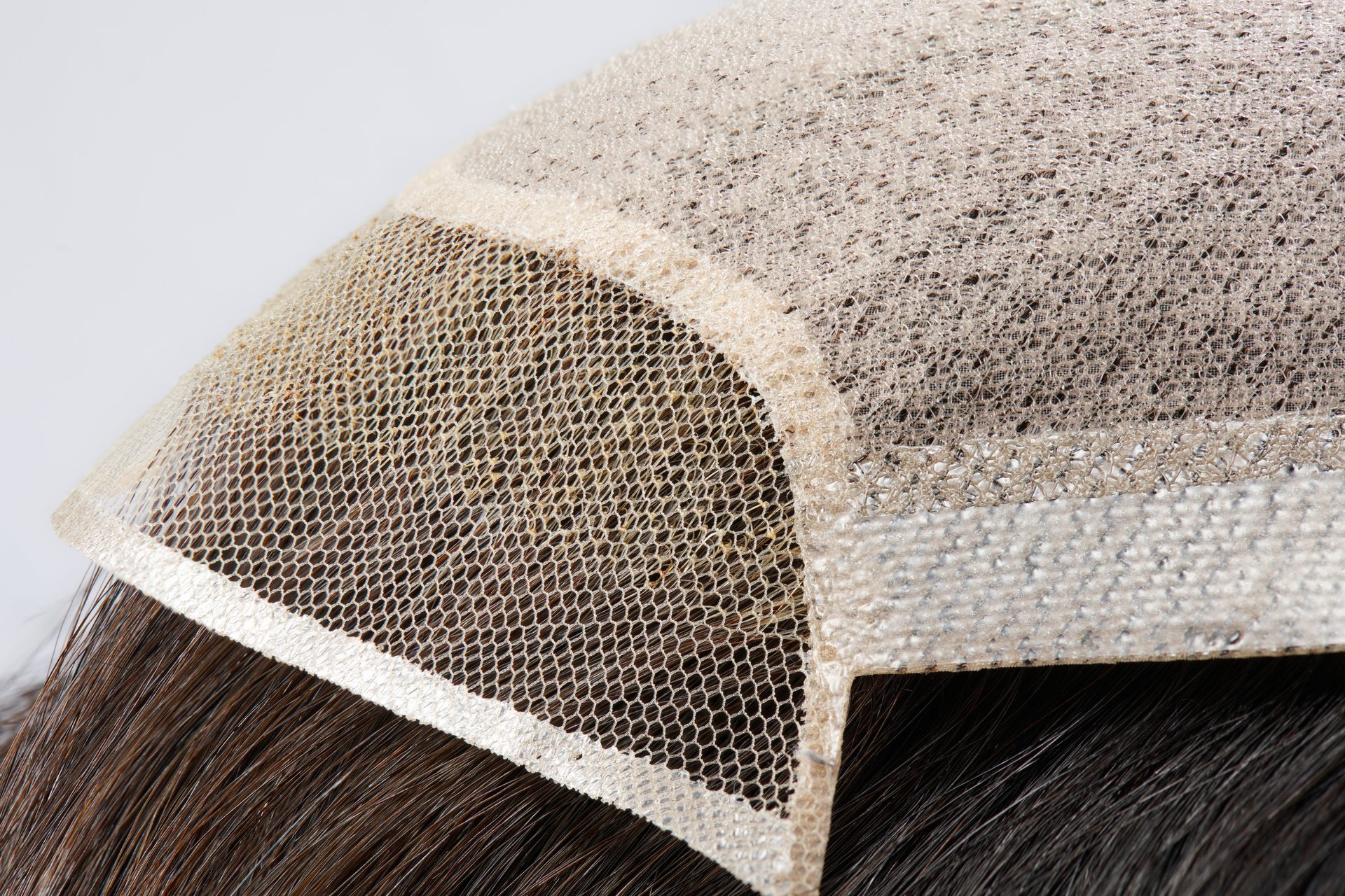 Lace base — a fine hand-knotted mesh