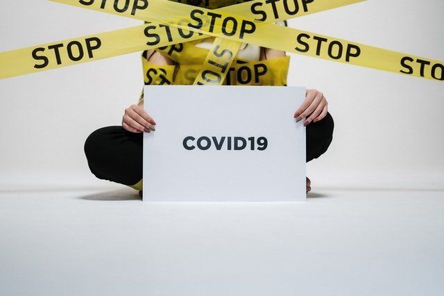 person holding covid sign 3951600