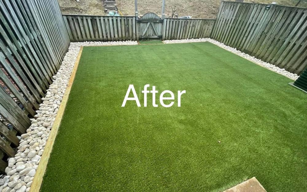 Fenced Yard Turf with Rock Border