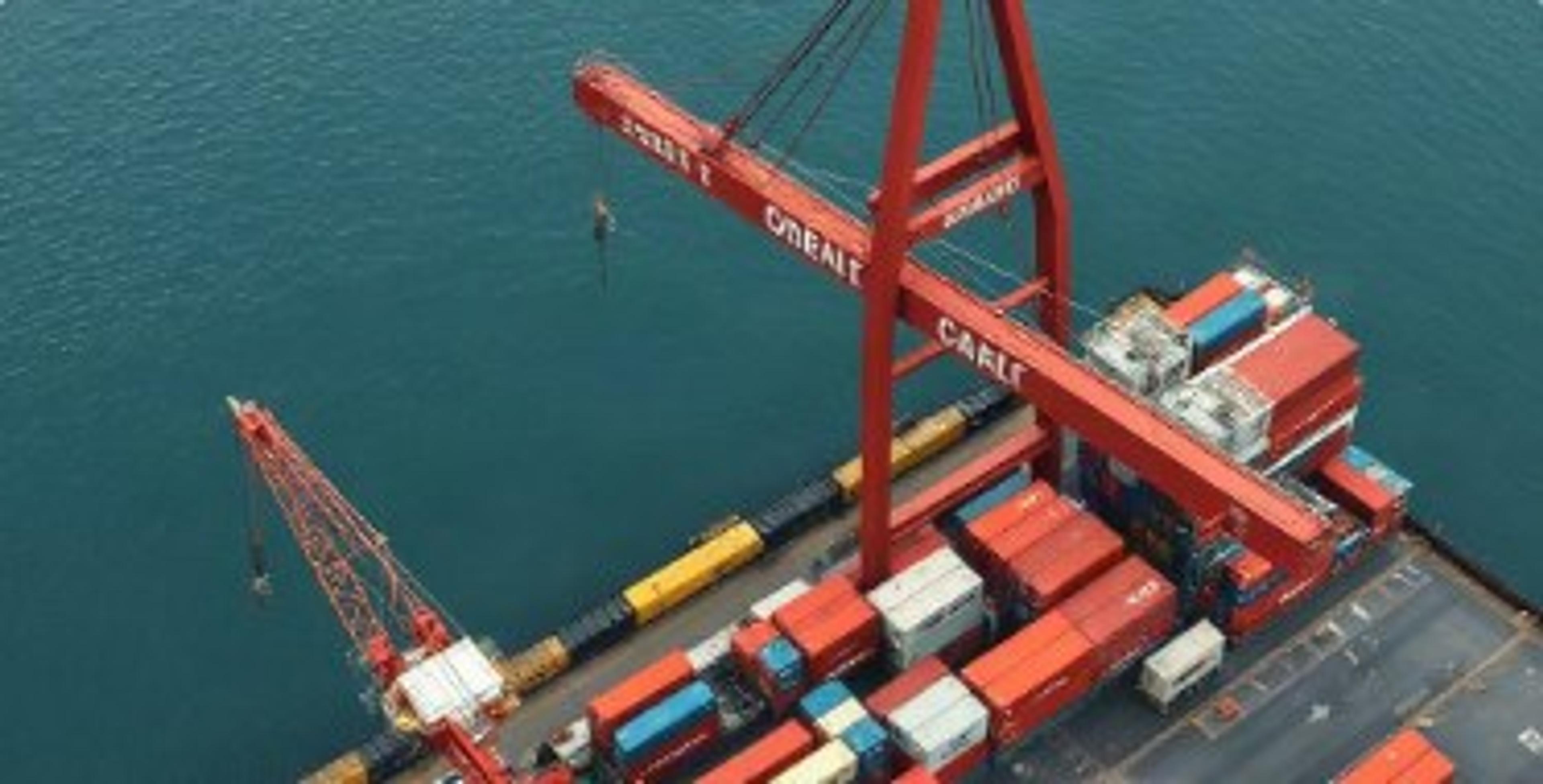 Aerial view of cranes loading containers at a port