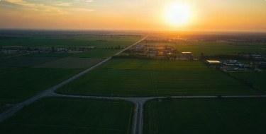 Aerial view of farmland at sunset
