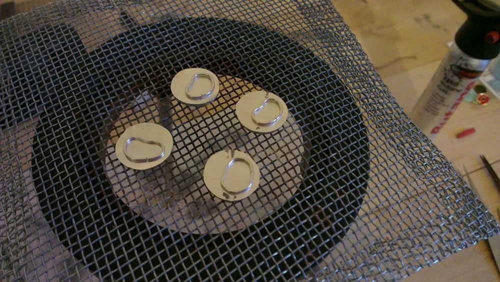 Silver wire soldered onto silver circles to create fluid design