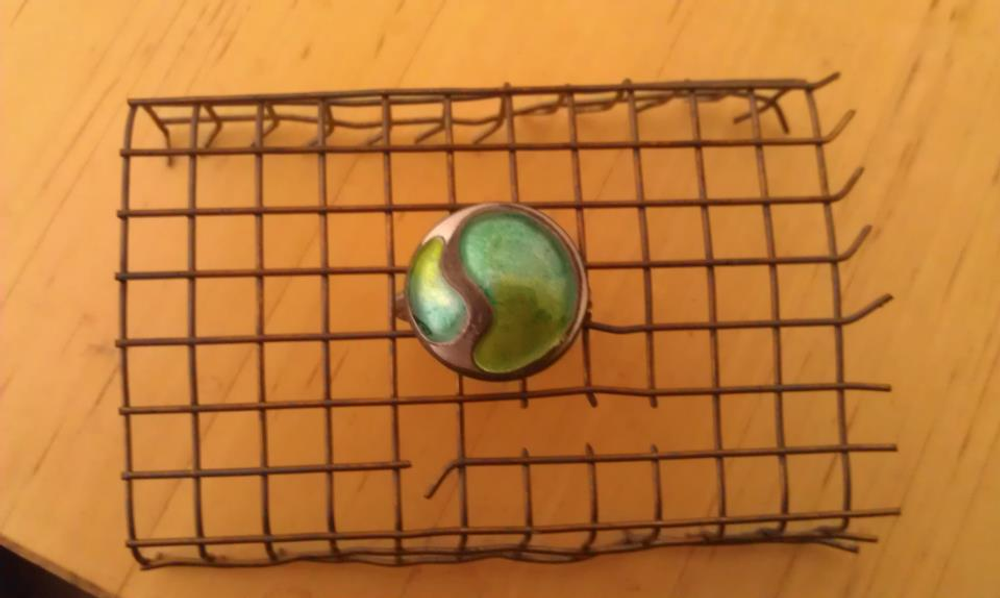 Silver ring cooling down after being fired in enamel kiln
