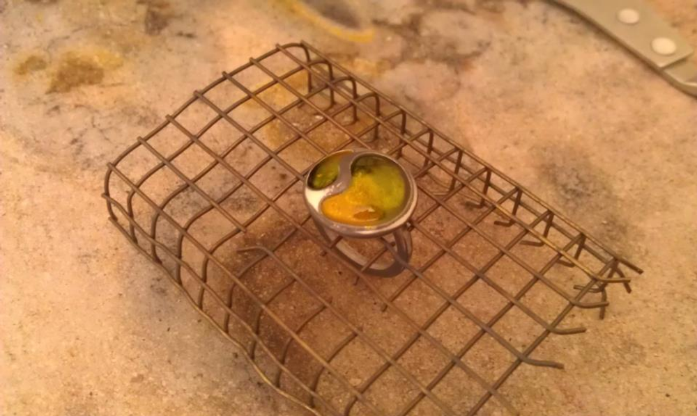 Silver ring cooling down after being in an enamel kiln