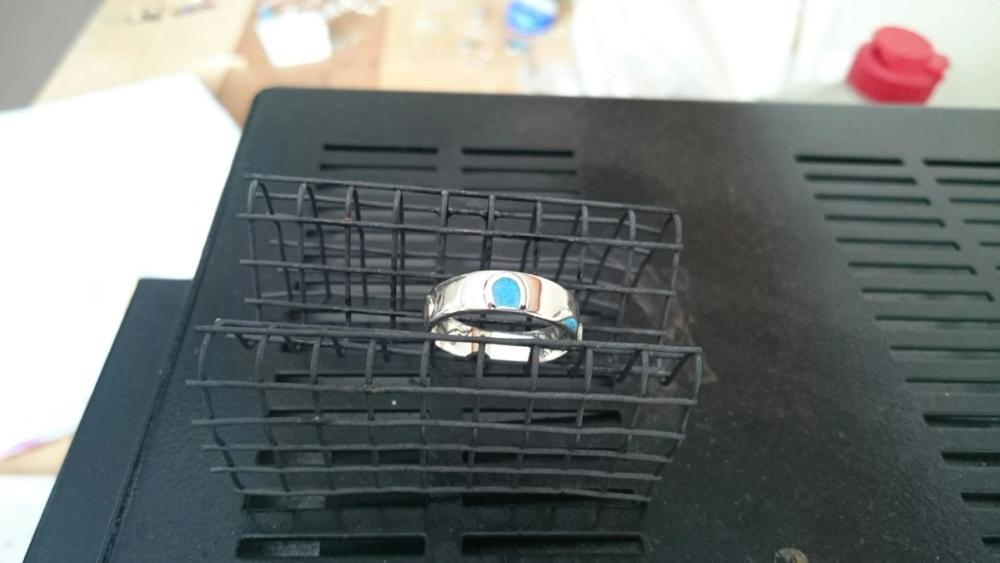 The ring with the wet enamel, sitting on top of my kiln to dry out before firing.