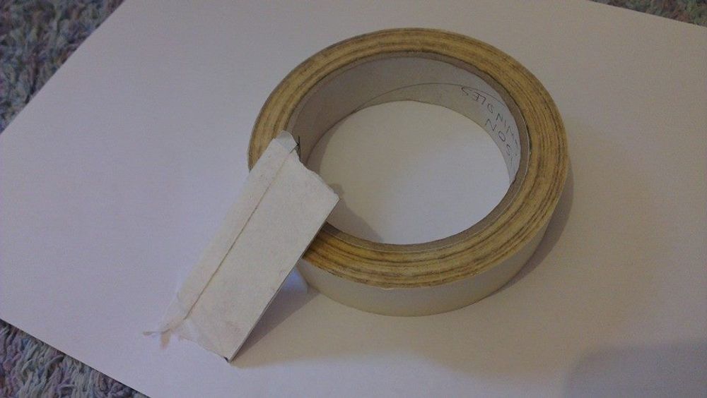 Masking tape on strip of silver