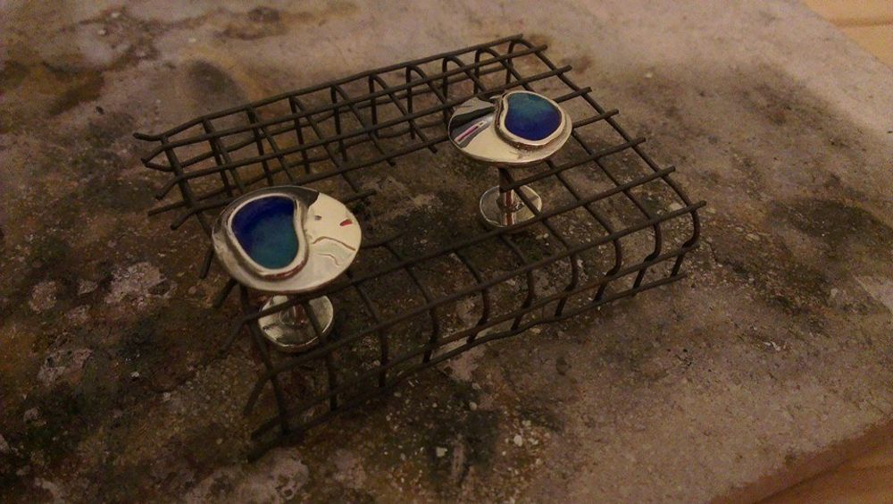 Cufflinks sat in wire cooling rack