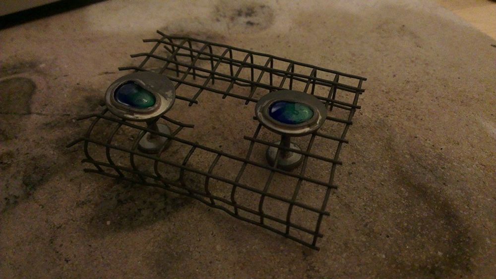 Cufflinks sat in wire cooling rack