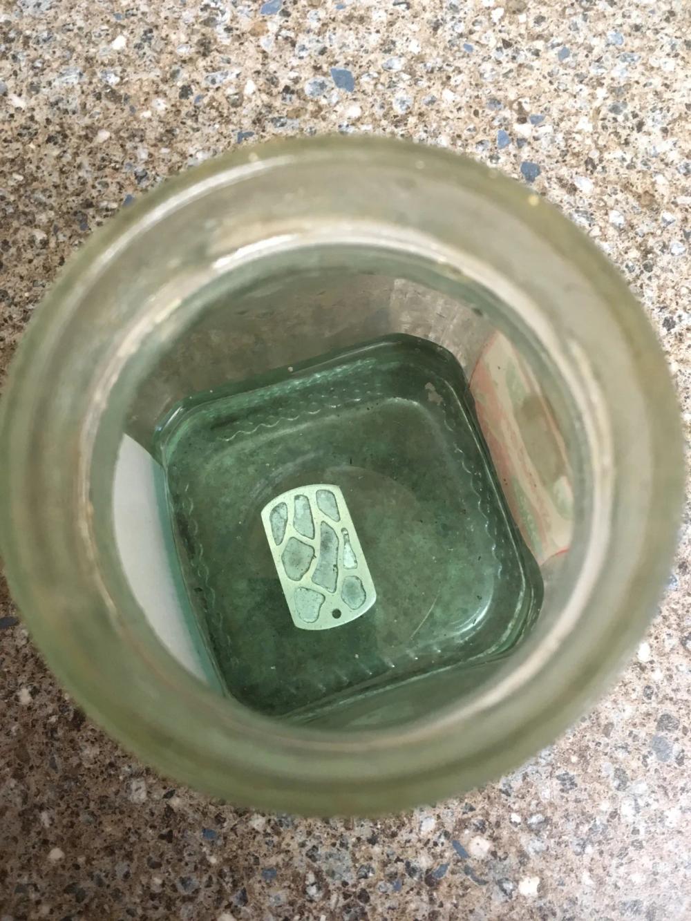 Soldered pendant in pickling powder solution