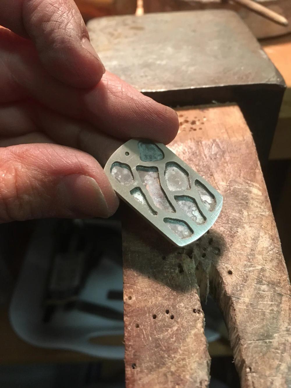 Two sheets of silver soldered on top of each other