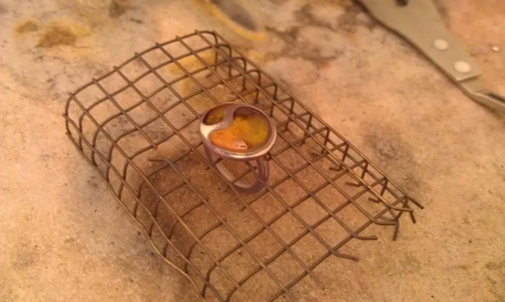 Silver ring that has just come out of an enamel kiln