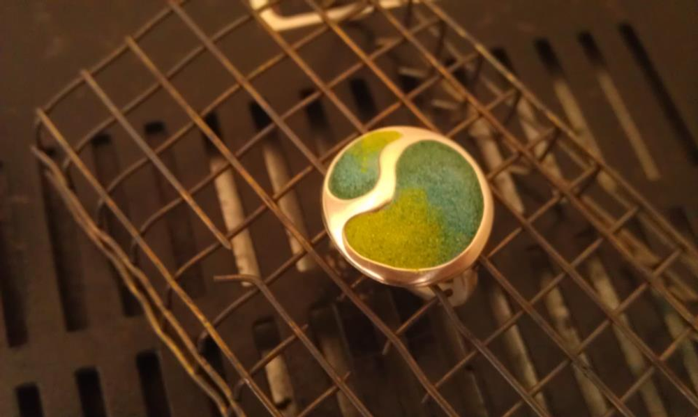 Silver ring with enamel powder before going in the kiln