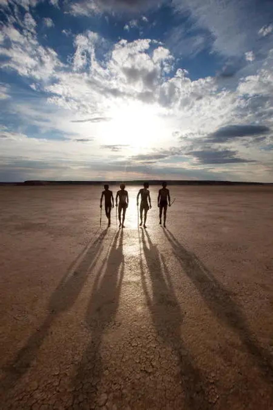 people walking on a beach