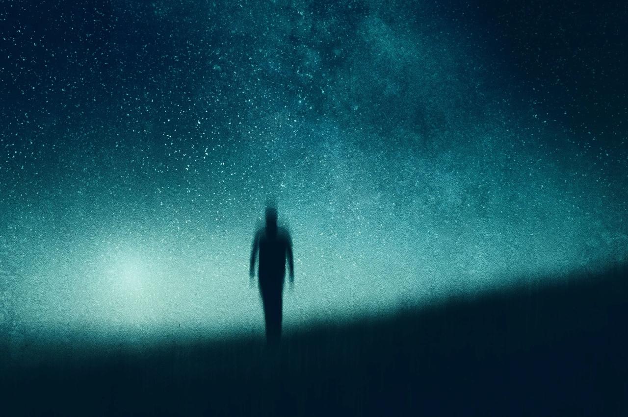 Blurred image of a silhouette of a person with a backdrop of stars