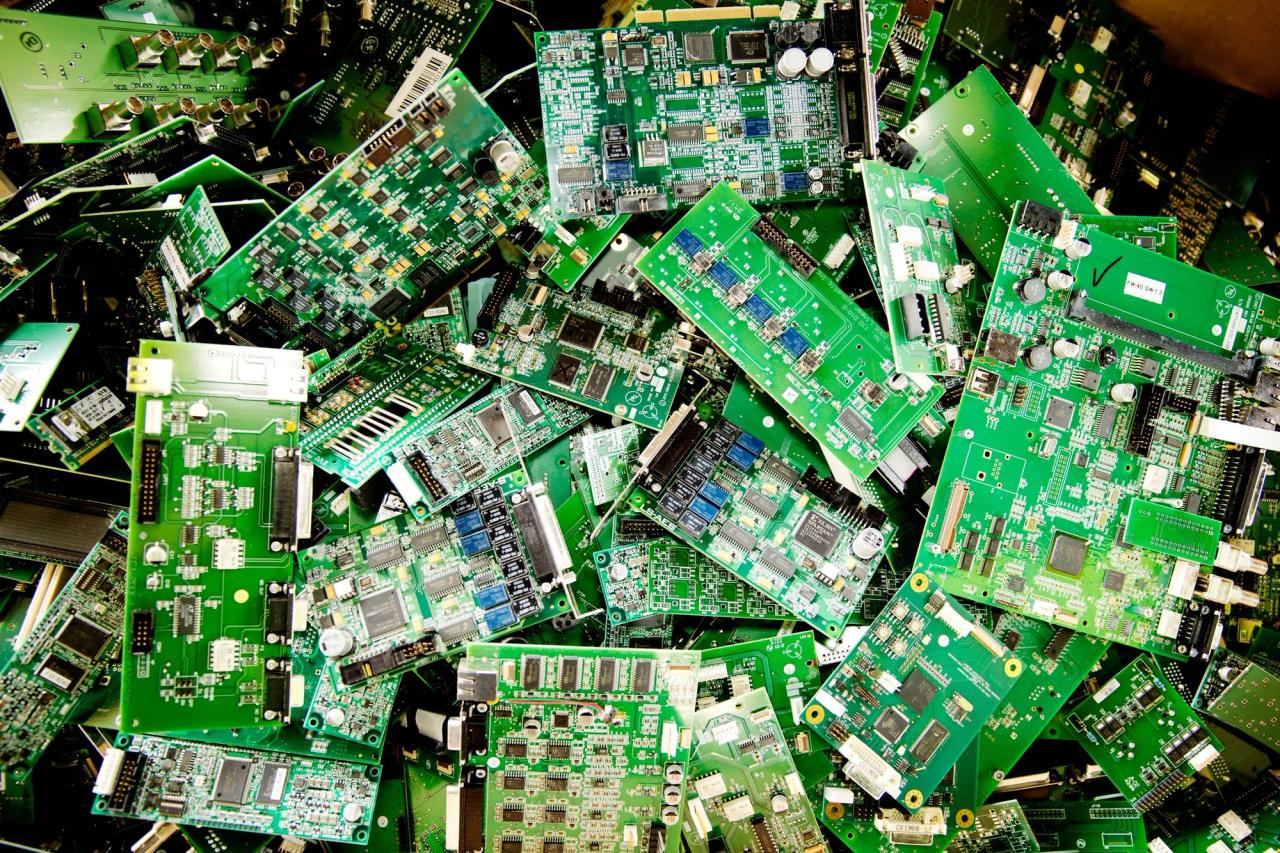 A pile of green circuit boards