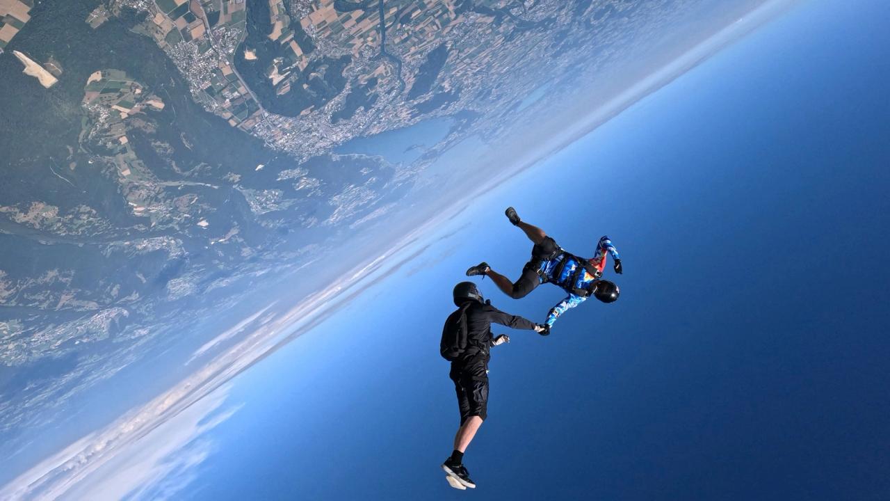 Skydivers falling back to Earth