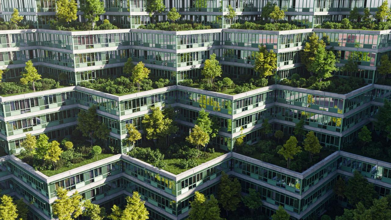 A tall building with trees and plants growing on every level.