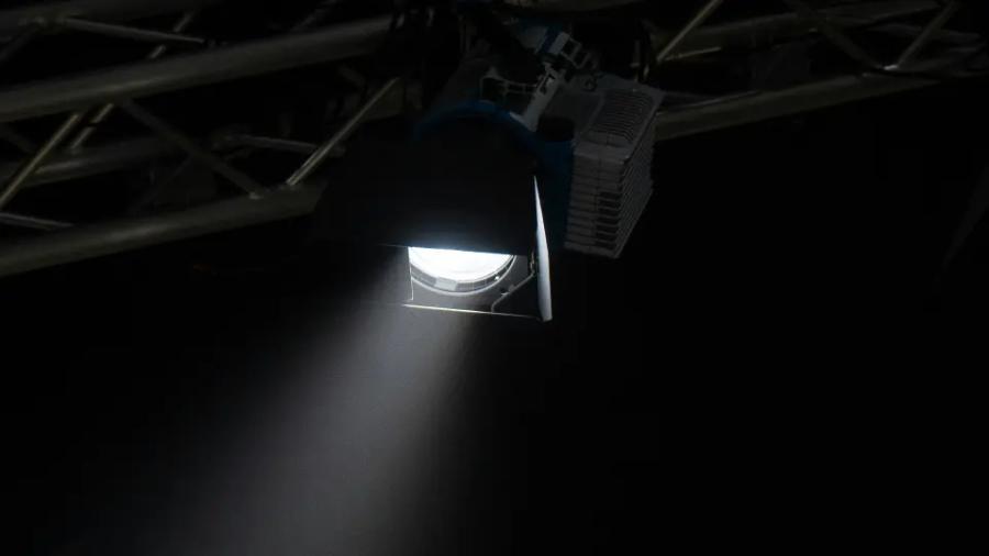 a bright spotlight in a pitch black room