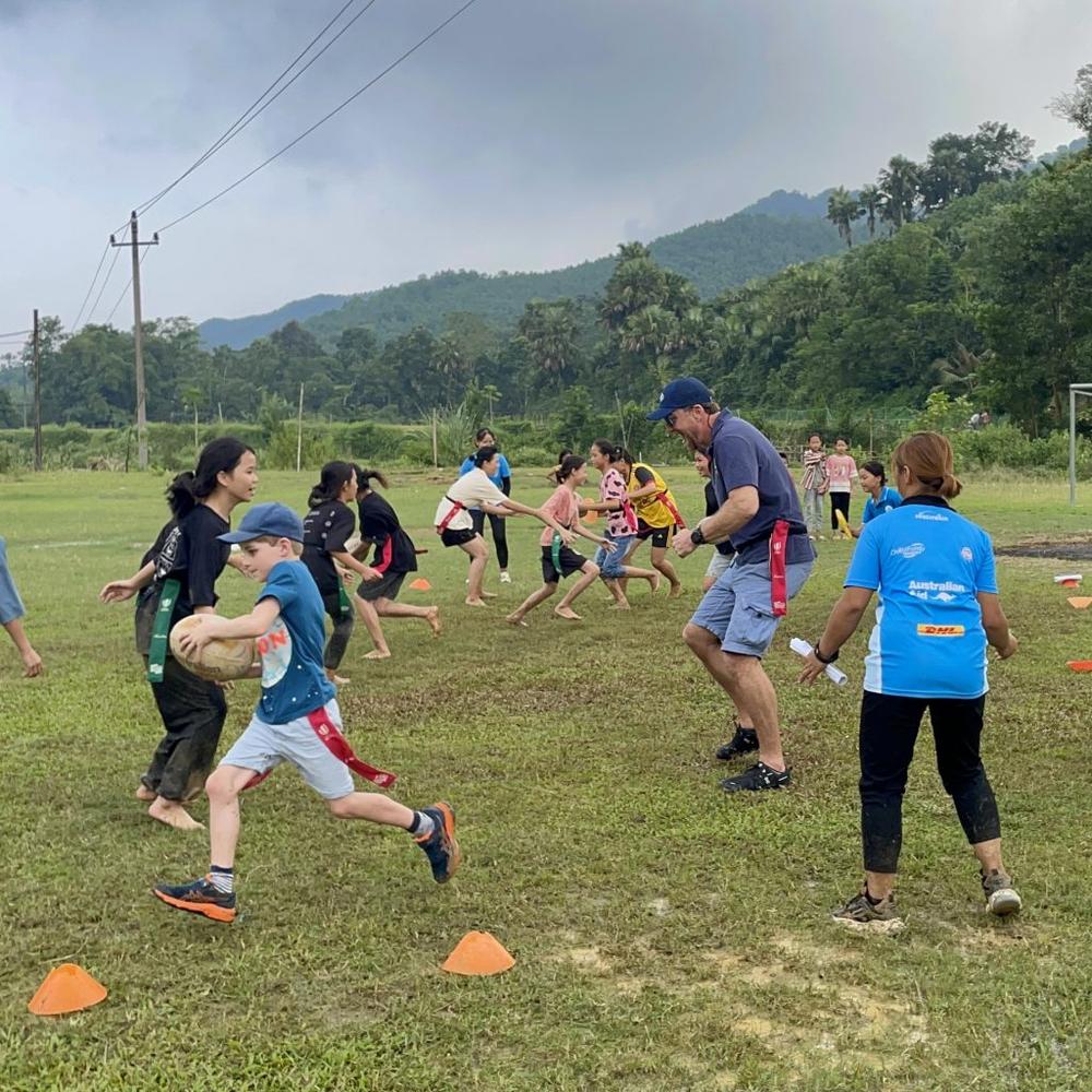 Chris and his sons experiencing ChildFund Rugby's Pass It Back program first-hand with a game of tag rugby. “The program presents a tremendous opportunity for both coaches and players alike,” Chris says.