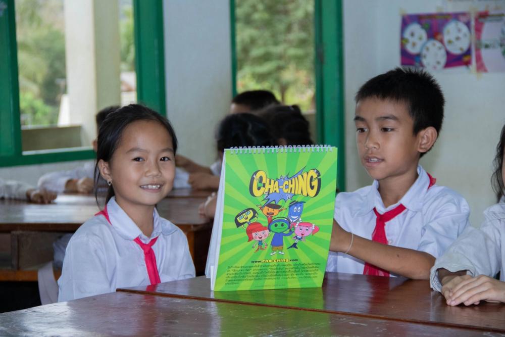 The ChildFund-supported "Cha-Ching" program focuses on four financial concepts (earning, saving, spending, and donating) to help students make informed decisions about their money and resources.