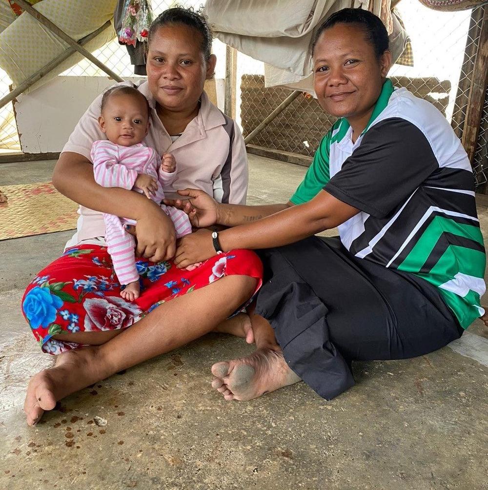 Josephine, a Village Health Assistant, with Wendy and her newborn in their community in Papua New Guinea