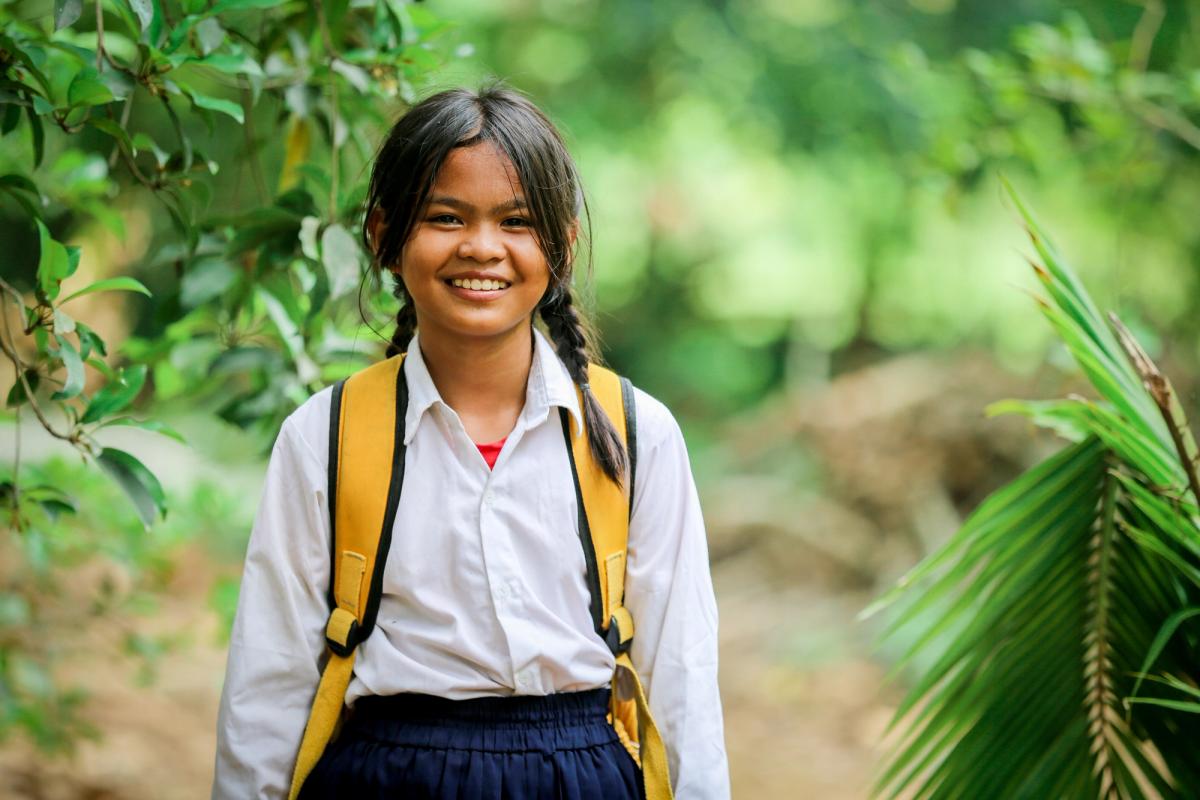Chenda, a student in Cambodia, on her way to school.