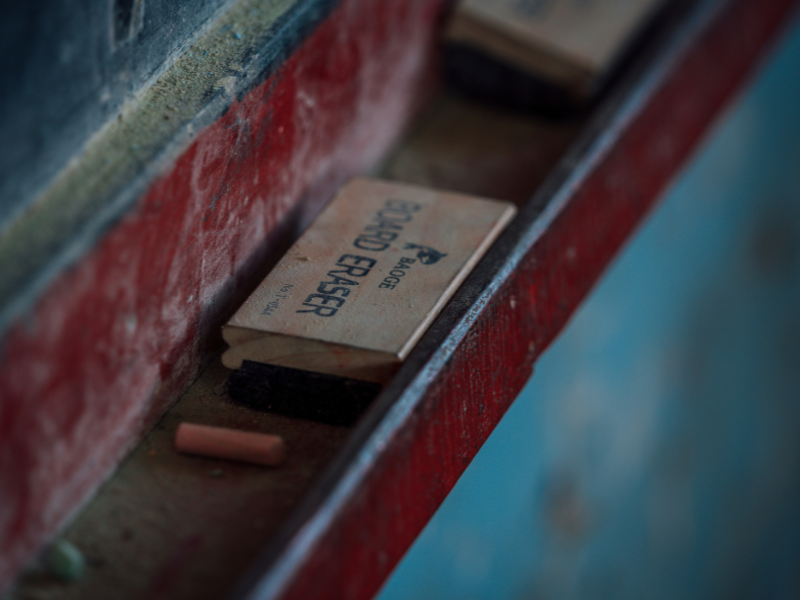 Teachers sometimes write lessons on the chalkboard for students to copy when textbooks are in short supply. @CFA/2026